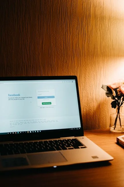 An individual reviewing cryptocurrency data on a laptop, emphasizing financial insights.